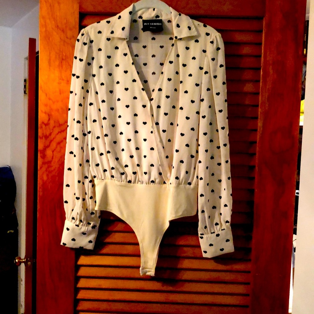 Kittenish  cream with black hearts bodysuit. Size medium